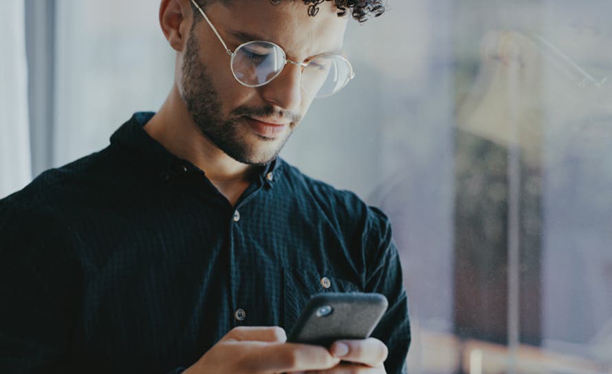 Young businessman using a cellphone.